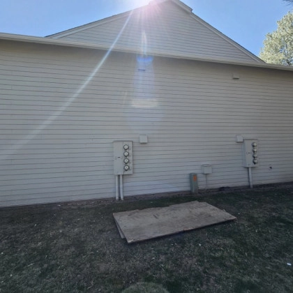 Back of house with white horizontal siding